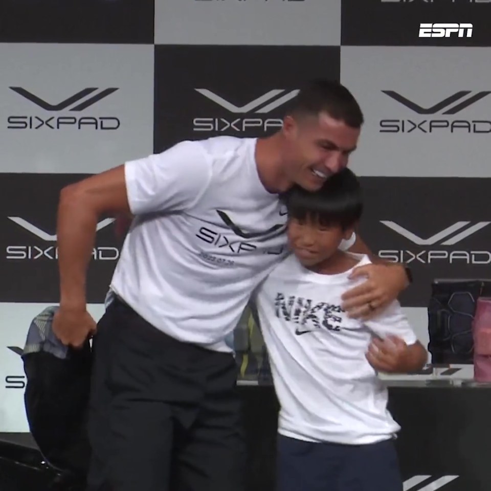 The star-struck kid got a hug from his idol after the exchange