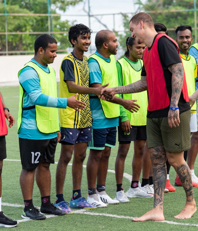 Ederson shakes hands with his opponents after the game