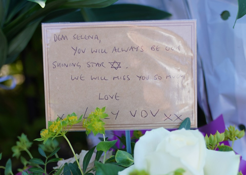 Flowers with a message that read: ‘Dear Selena, you will always be our shining star. We will miss you so much’