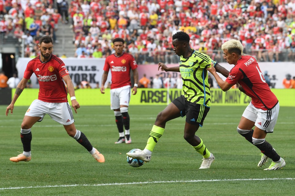 Eddie Nketiah tries to evade United players at the MetLife Stadium