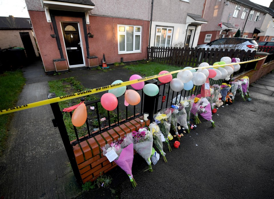 Flowers and tributes left outside the property following his death