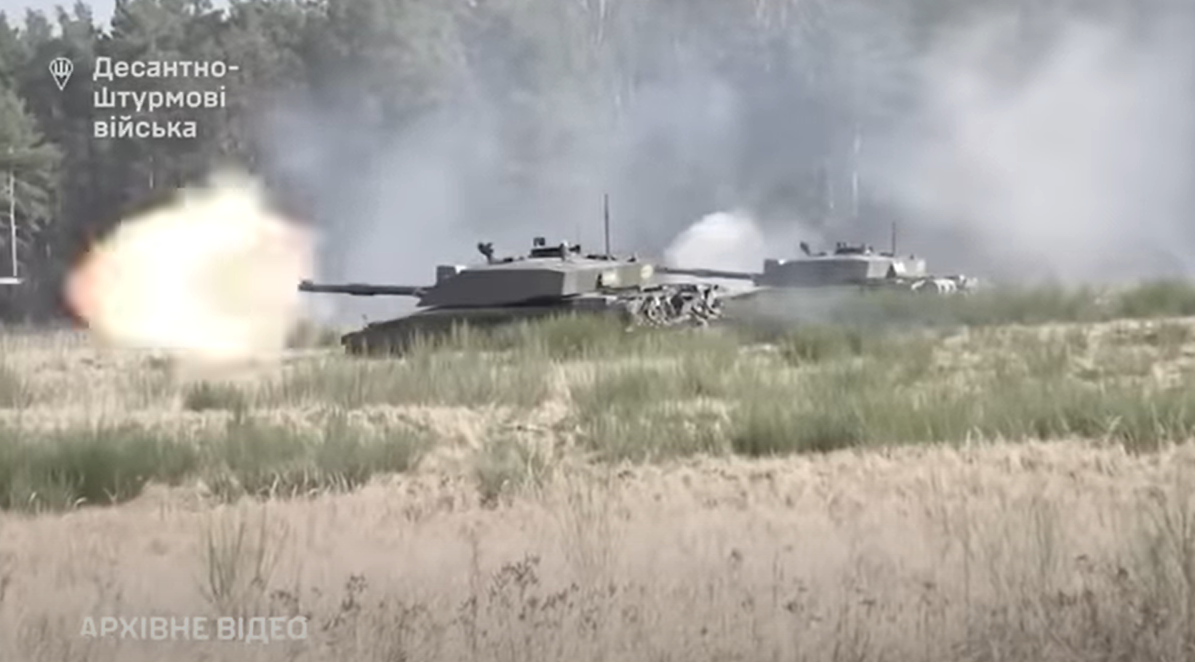 Britain's Challenger 2 tanks blast their cannons during training exercises in Ukraine