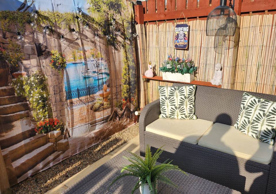 Rebecca Brennan transformed her fence for just £13 using a shower curtain