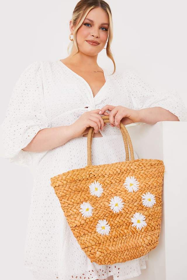 Hit the beach with the Daisy straw beach bag for £28