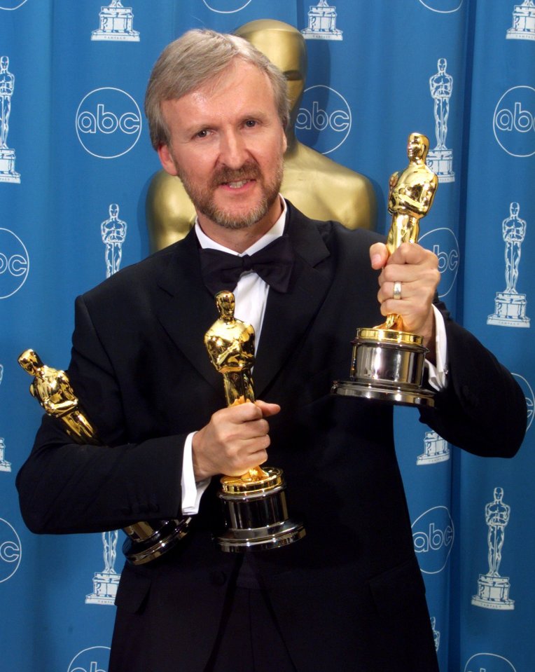 James Cameron shows off his three Oscars for Titanic in 1998