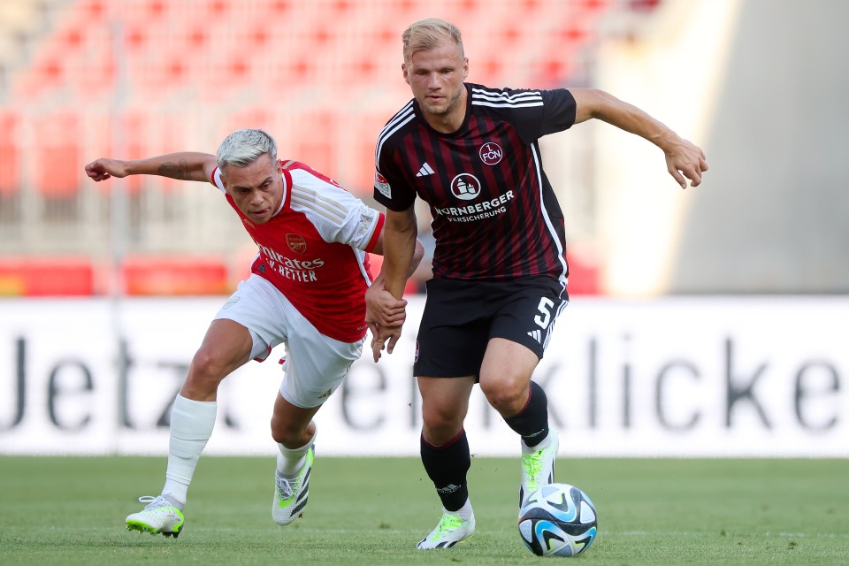 Leandro Trossard battles for possession