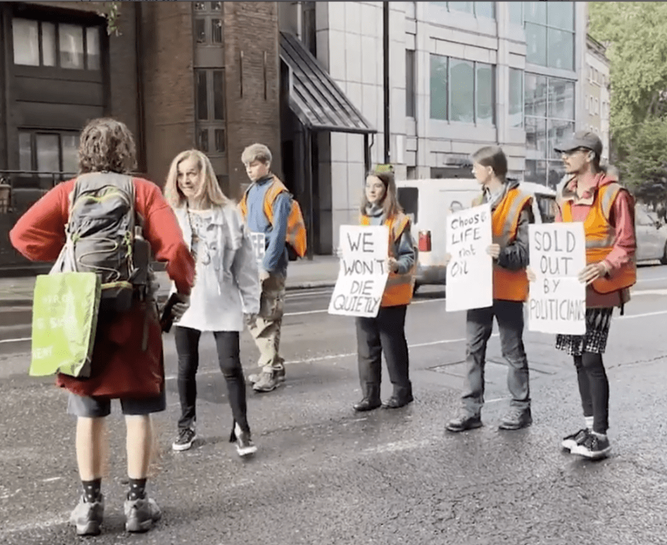 The woman was seen yelling that she was pregnant in the confrontation with the Just Stop Oil protesters