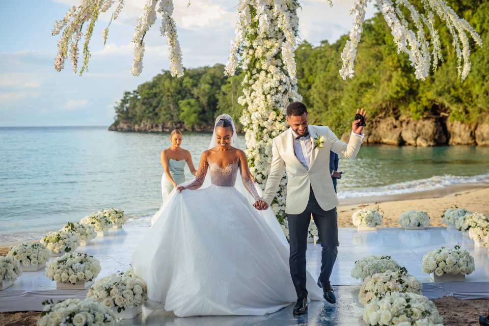 Leigh-Anne looked stunning in a flowing white dress while the groom wore a cream blazer