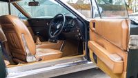 The brown leather interior is said to be in good condition but showing some signs of wear