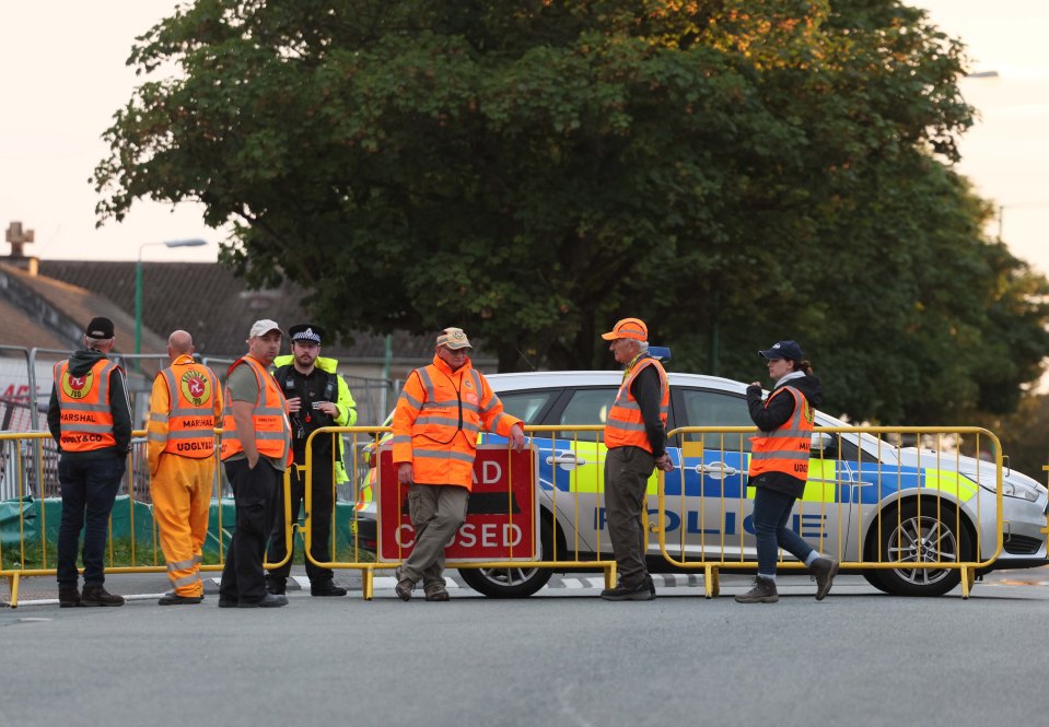 Police and race marshals at the Southern race course at Castletown on the Isle of Man