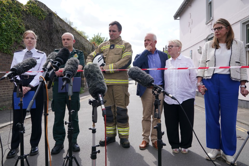 Chair of the board of governors John Tucker, third from right with headmistress Helen Lowe, who is holding hands with future head Sharon Maher, said the school had been 'profoundly affected by this tragedy'