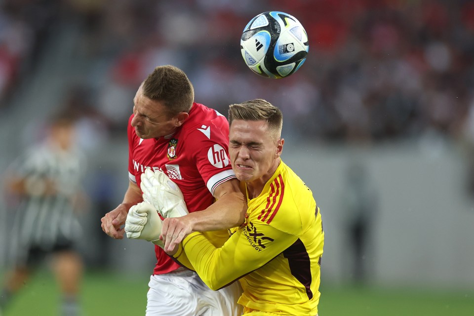 Paul Mullin was clattered by Man United goalkeeper Nathan Bishop