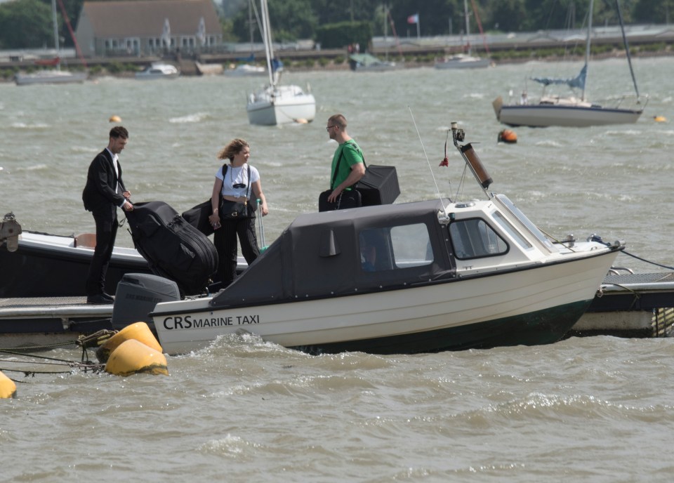 The band were seen getting on the boat