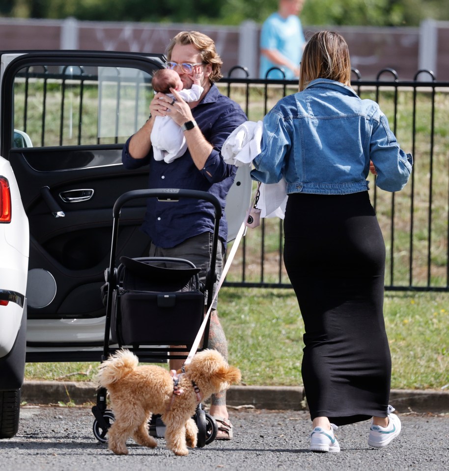 Lorri cradles his adorable newborn