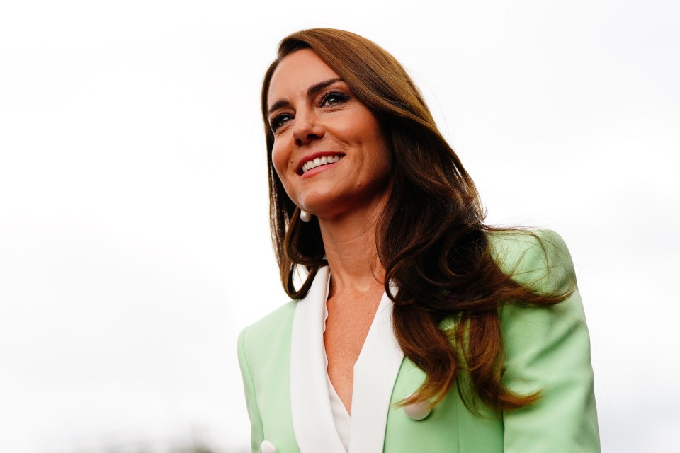 Kate was all smiles on arriving at the All-England Lawn Tennis Club for the day