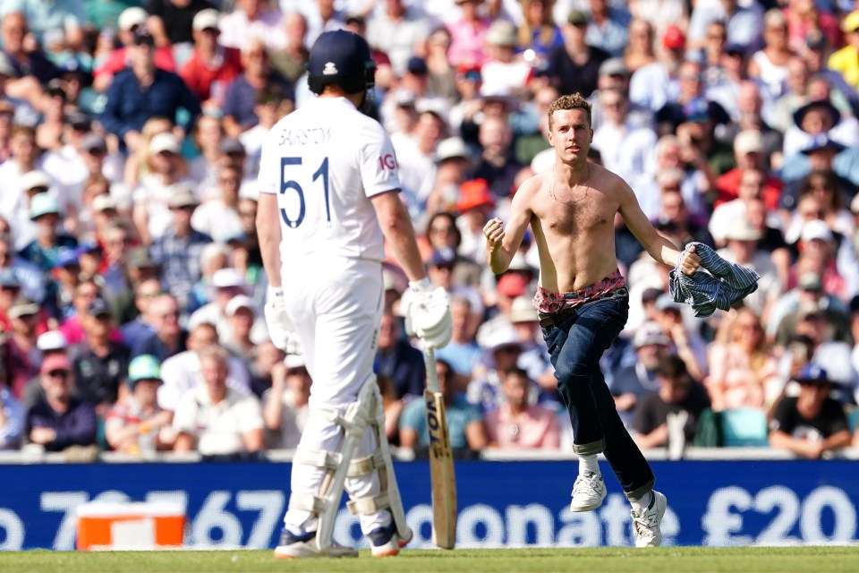 A topless streaker invaded the Ashes clash between Australia and England