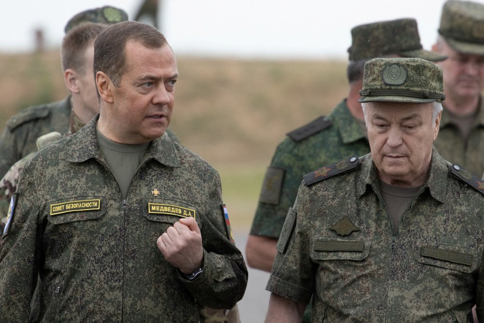 Medvedev, left, pictured with Deputy Defence Minister Nikolay Pankov, has made repeated threats against the West