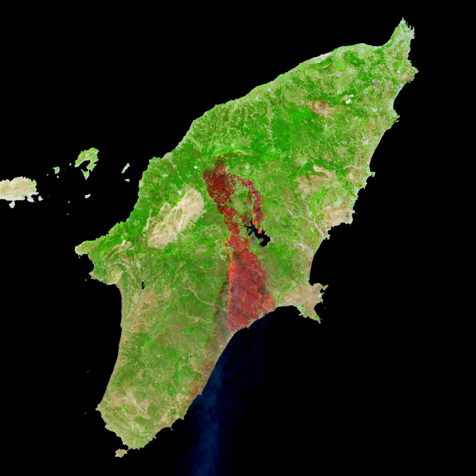 A satellite image shows the widespread area engulfed by wildfires in Rhodes