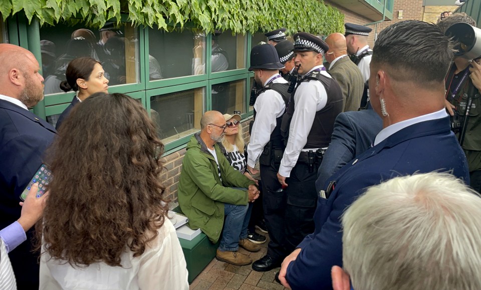 They were rushed off the court by police and arrested