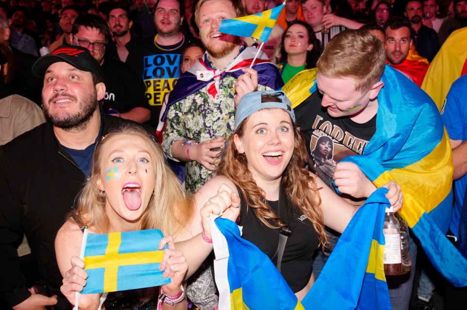 Swedish fans celebrating after their country clinched its seventh victory