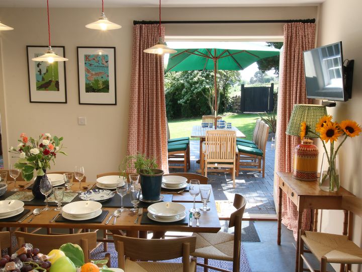 The dining room leads to the huge garden of the property