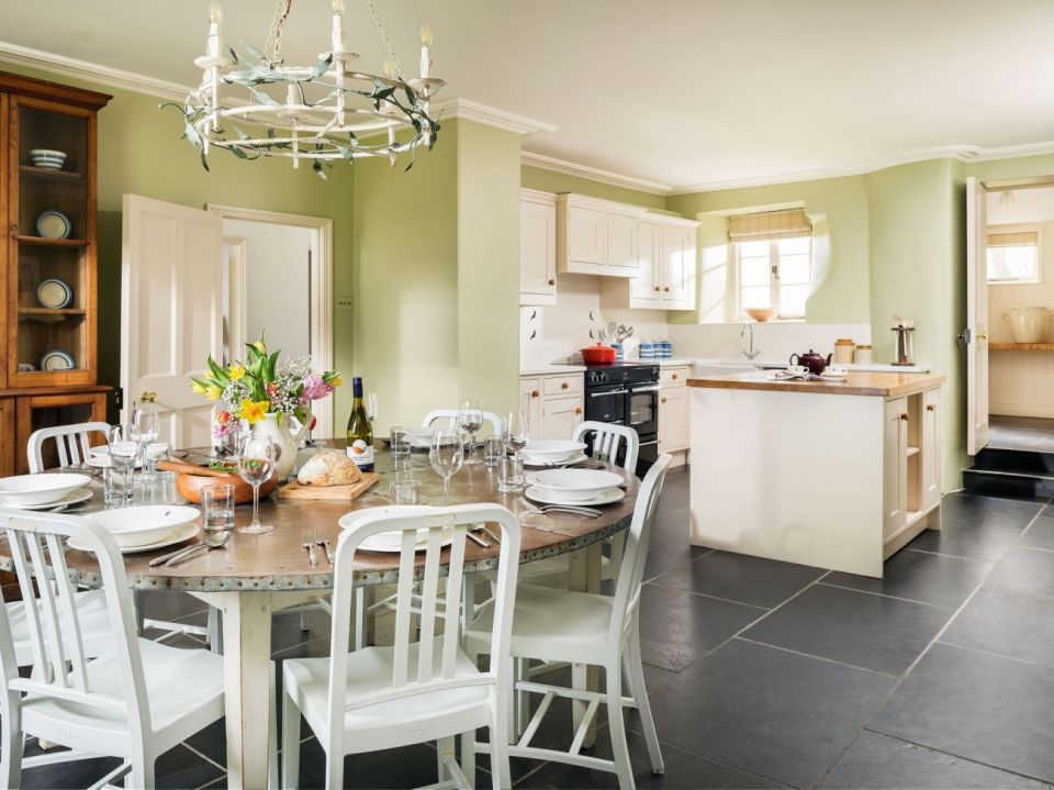 The slate-floored kitchen comes with an American-style fridge and plenty of cookware