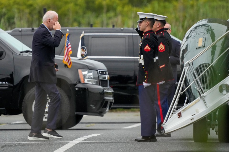 Joe Biden walks towards Marine One before landing in the UK for his visit