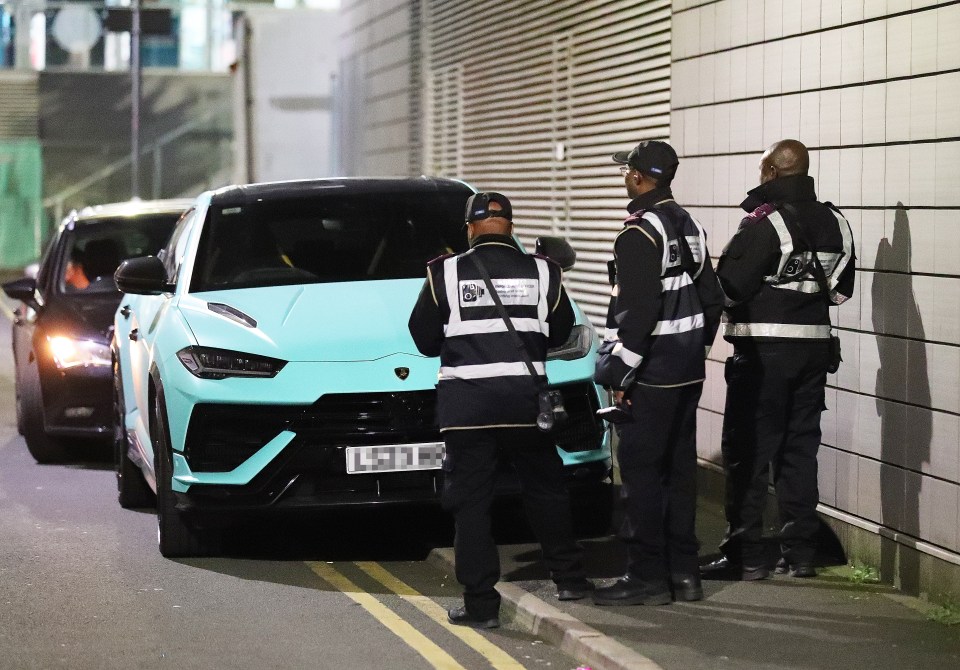 Three traffic wardens did nothing to move the car but issued a Penalty Charge Notice