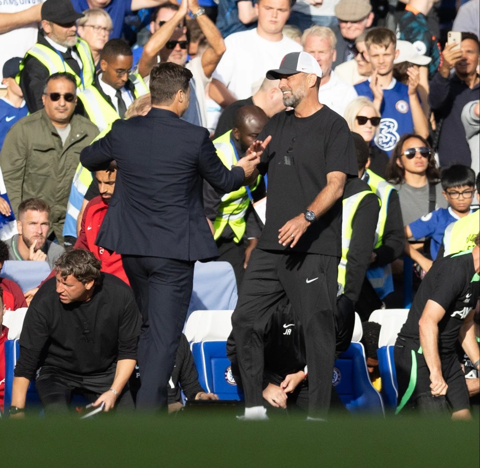 Mauricio Pochettino and Jurgen Klopp embrace after the draw