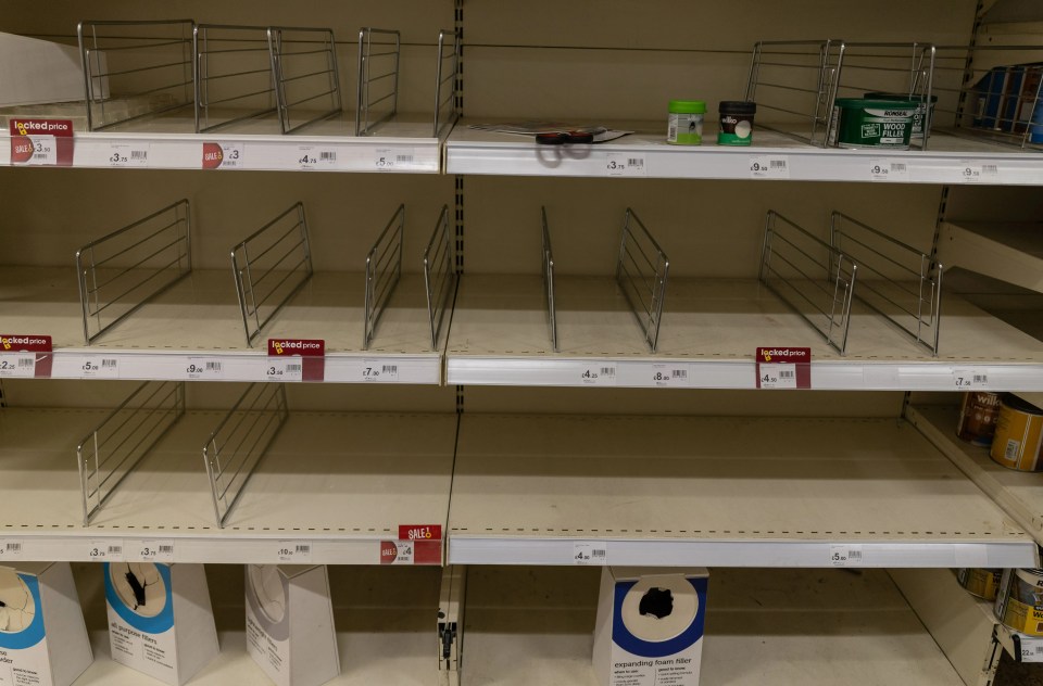 More empty shelves inside one London Wilko with tags saying 'sale'