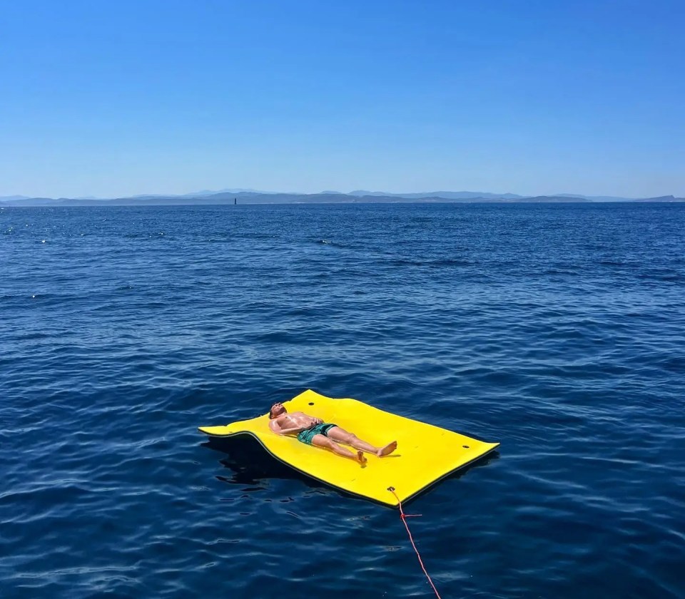 He was pictured relaxing on a float in the sea