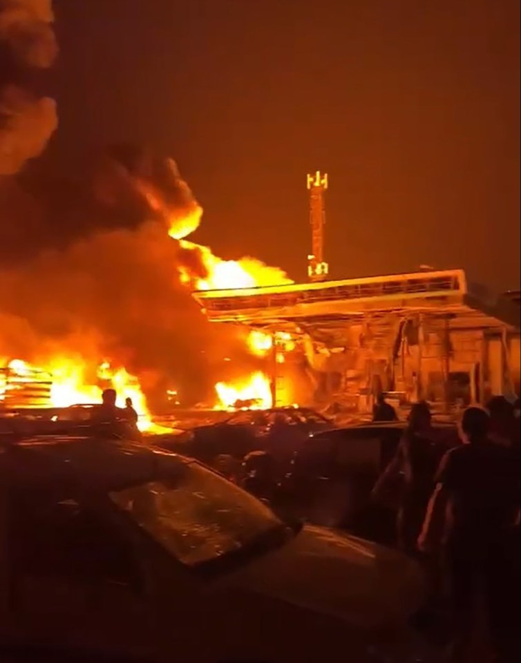 A crowd gathered to watch the fire before the explosion