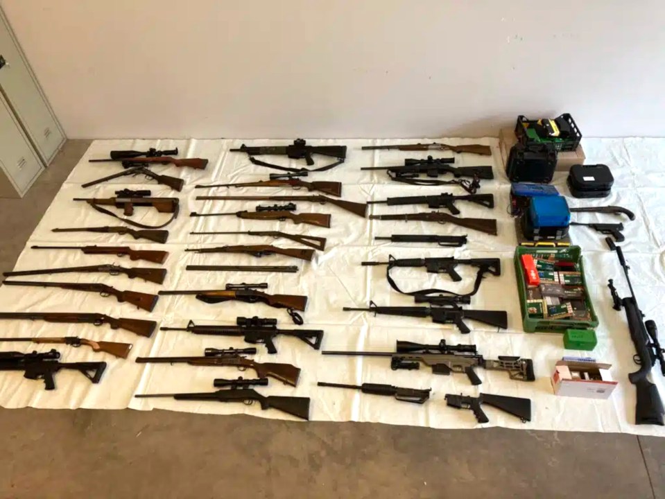 An arsenal of guns, ammo and bomb making materials were discovered in the property