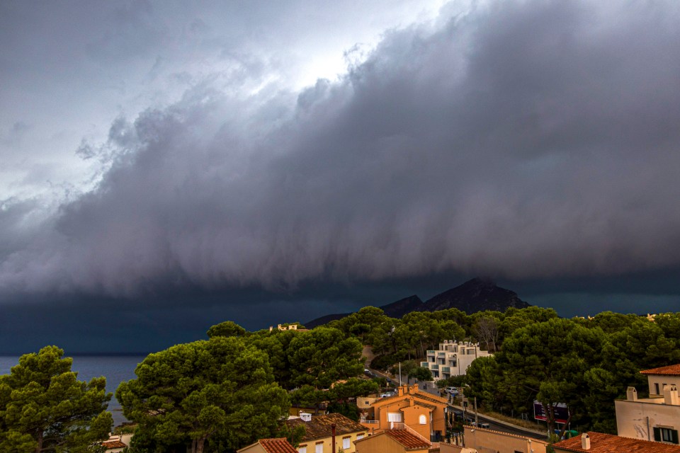 Ominous black clouds rolled in over the island this morning