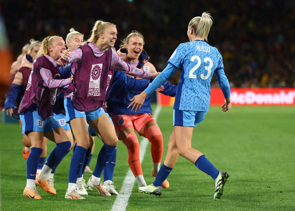 England's players stormed off the bench to celebrate with Russo