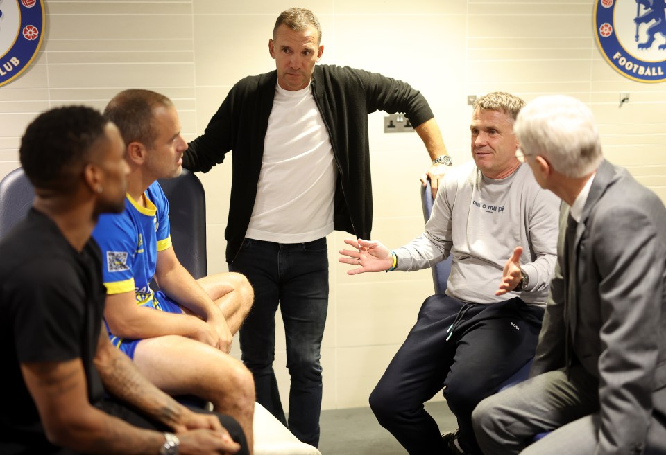 Before the game he (second from right) chatted with Arsene Wenger, Joe Cole and Andriy Shevchenko