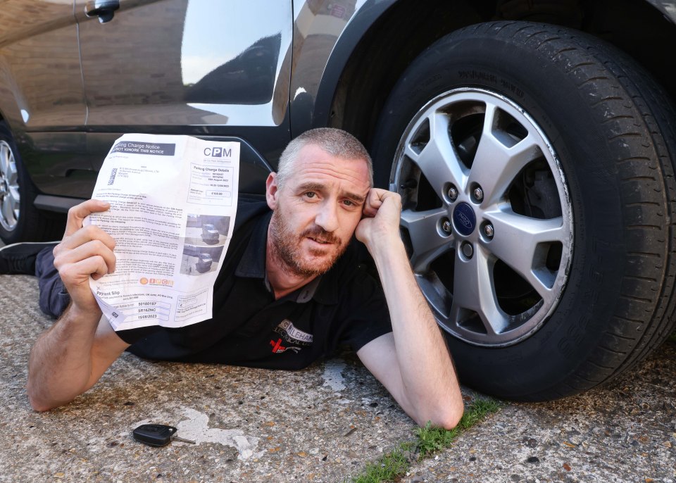 Nick Ellcock was given a £100 parking fine while changing a flat tyre