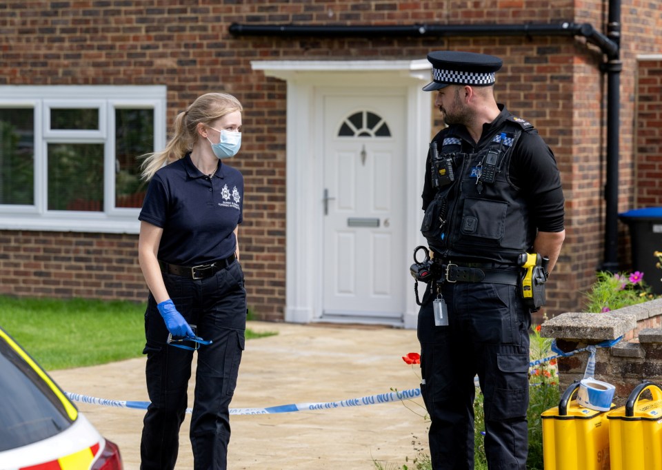 Police outside of the home on Hammond Road, Woking,