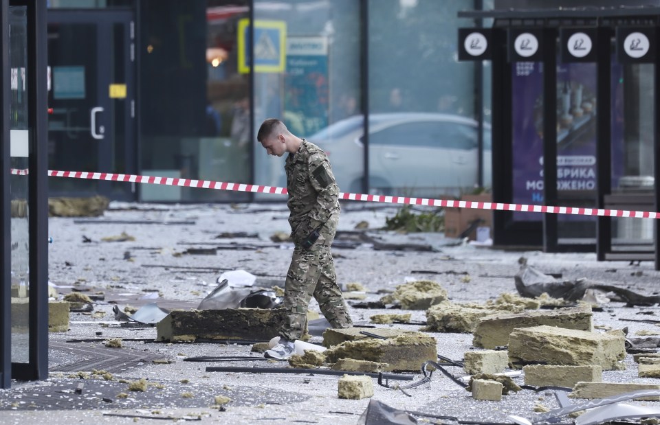 A soldier walks among the rubble following the attack on July 30