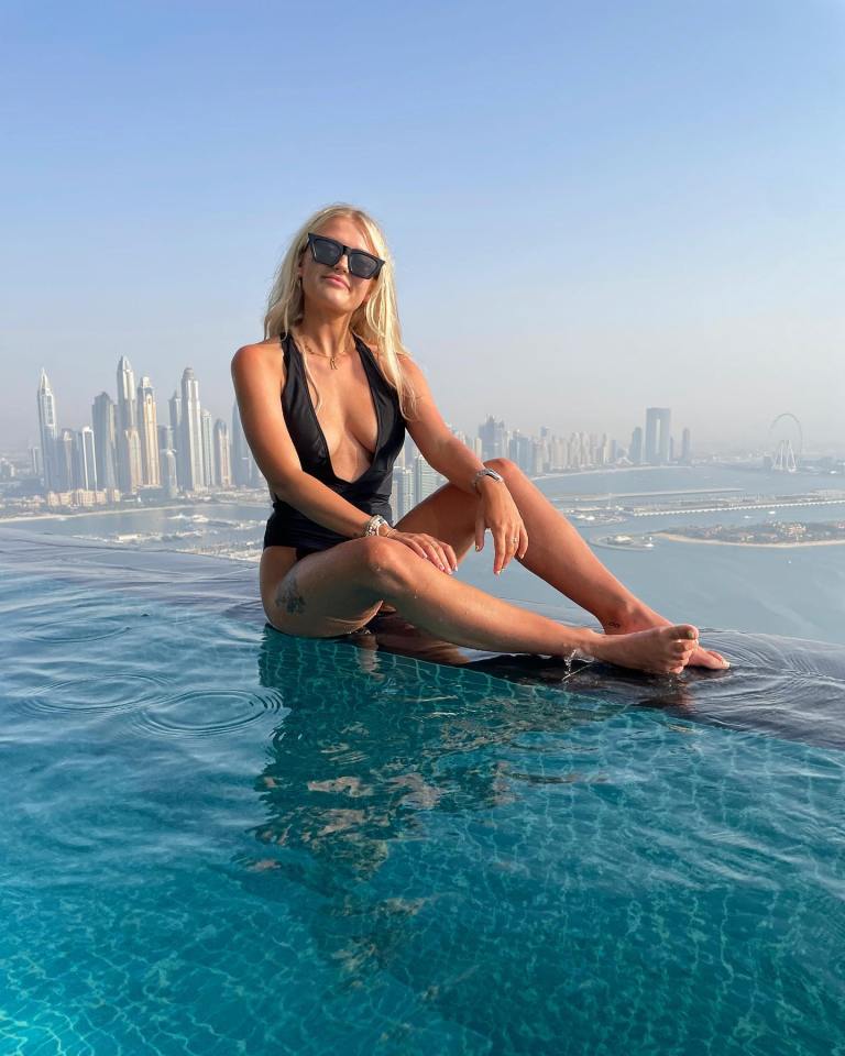 Actress Lucy Fallon, 27, stunned in a plunging black swimsuit as she enjoyed a romantic Dubai getaway with boyfriend Ryan Ledson