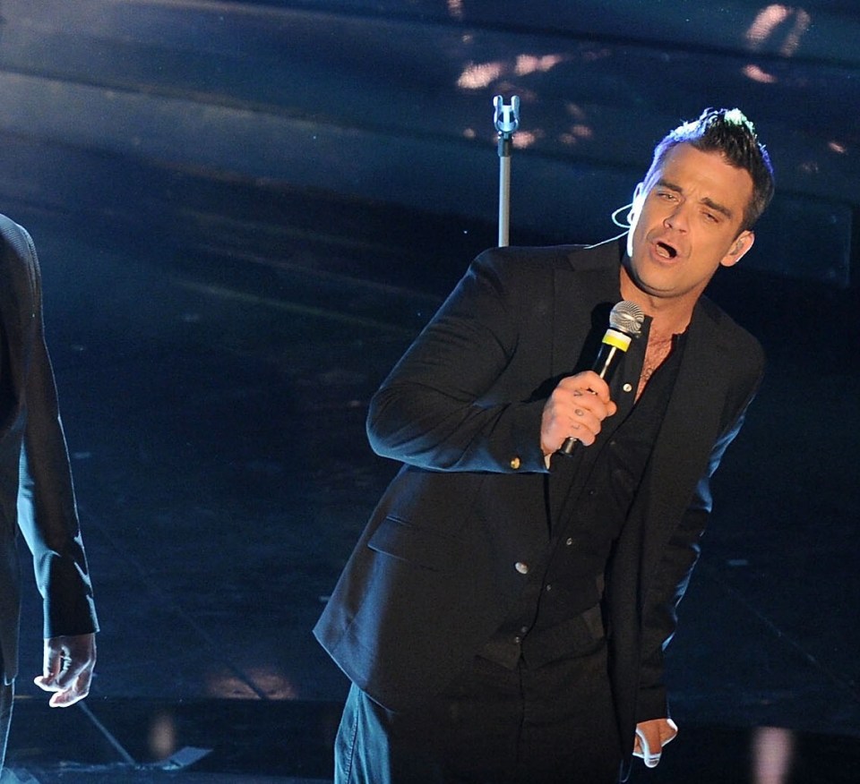 Robbie Williams has opened up about an embarrassing moment he suffered on stage whilst performing with Take That in Amsterdam