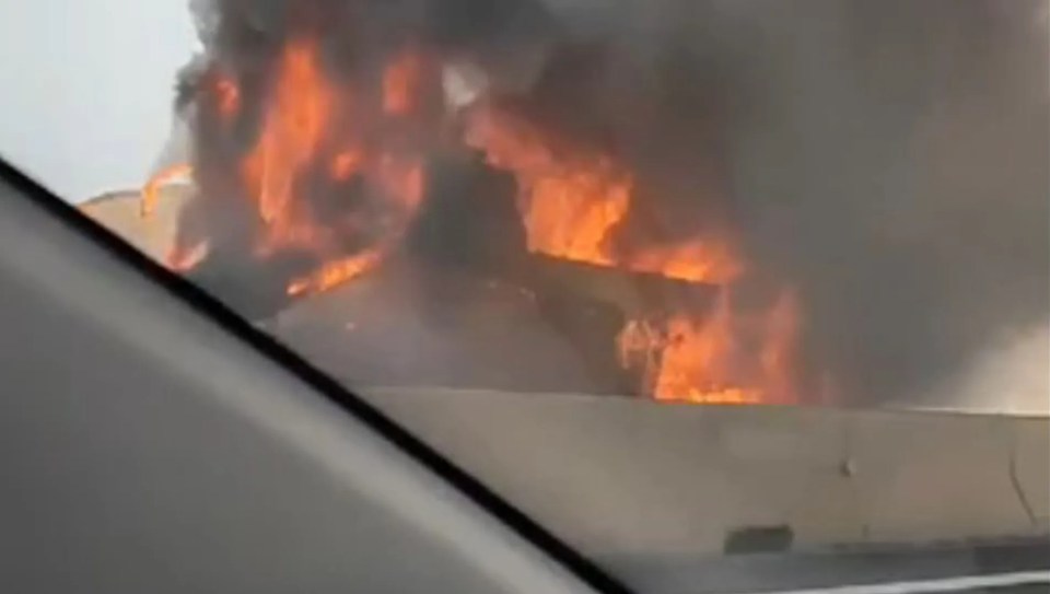 A view of the bus fire from a nearby car