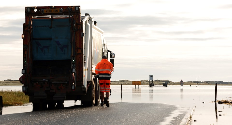 A bin wagon heading onto the causeway to Holy Island in Northumberland