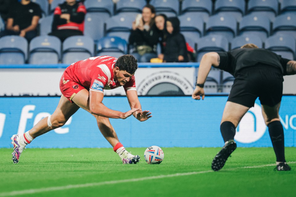 Sam Stone, pictured scoring against Huddersfield, has been praised for his recent showings by Salford boss Paul Rowley