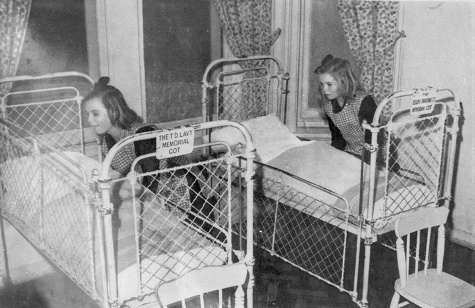 Girl's Dormitoryu Dalwood Children's Home in Seaforth, New South Wales, circa1930. These eerie pictures from Magdalene Laundries around the world, show children eating dinner as nuns watch over and young women working on heavy equipment. The establishments were set-up to house 'fallen women.' The term was used to to imply female sexual promiscuity, however in reality they were women who had children out of wedlock. ... SEE COPY ¿ PIC BY NEWS DOG MEDIA ¿ +44 (0)121 517 0019