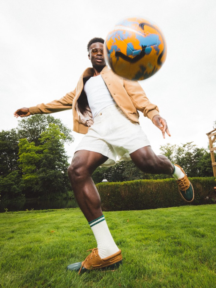 He was also snapped playing with a football in the stylish clothes