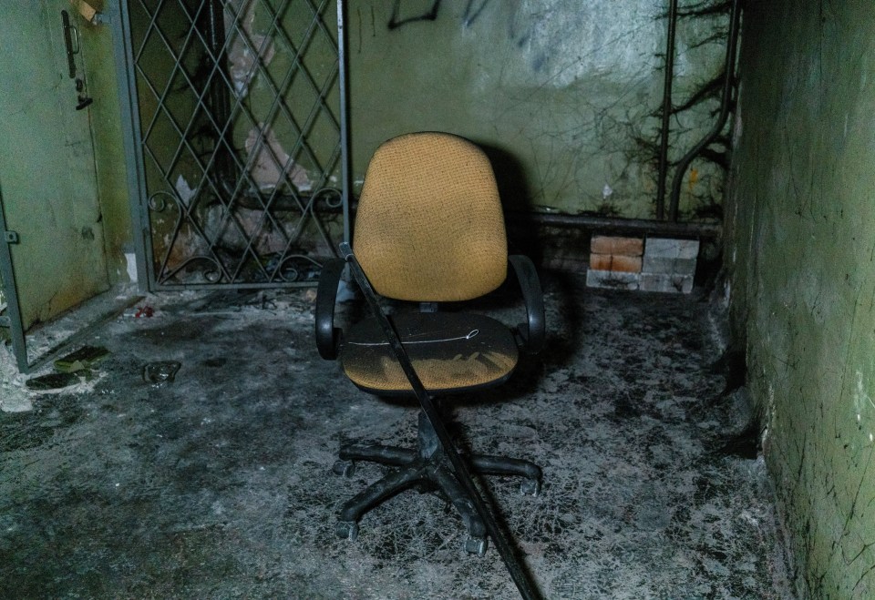 Plastic ties for torture and a broken chair are seen inside the basement of an office building in Kherson