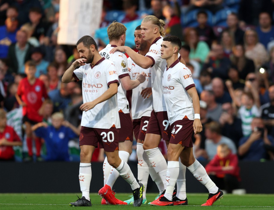 Manchester City's Erling Haaland (second right) celebrates scoring their side's first goal of the game during the Premier League match at Turf Moor, Burnley. Picture date: Friday August 11, 2023. PA Photo. See PA story SOCCER Burnley. Photo credit should read: Nigel French/PA Wire. RESTRICTIONS: EDITORIAL USE ONLY No use with unauthorised audio, video, data, fixture lists, club/league logos or "live" services. Online in-match use limited to 120 images, no video emulation. No use in betting, games or single club/league/player publications.