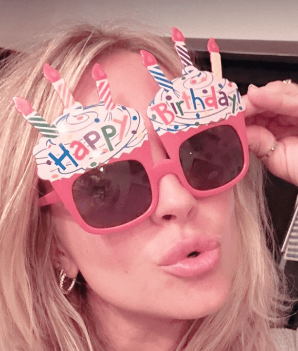 She posed with fun 'happy birthday' glasses