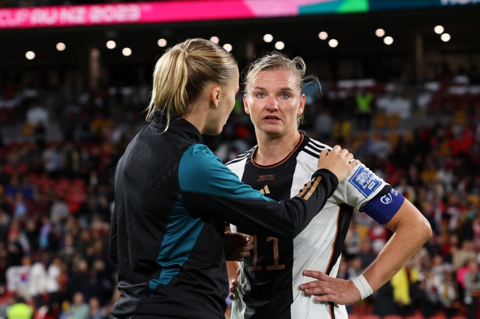 Alexandra Popp struggles to hold back the tears after the final whistle